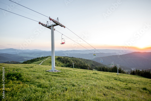 Landscape view on the beautiful Carpathian mountains with horeses and ski lift on the High Top near the Slavske village in Ukraine photo