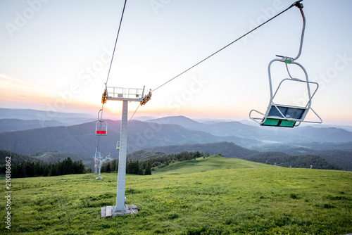 Landscape view on the beautiful Carpathian mountains with horeses and ski lift on the High Top near the Slavske village in Ukraine