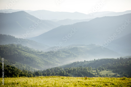 Landscape view on the beautiful Carpathian mountains from the High Top near the Slavske village during the sunrise in Ukraine