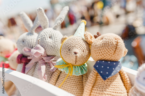 small knitted baby toys for sale at outdoor handmade market photo