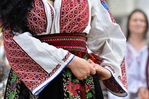 Beautiful traditional Romania costumes from Dobrogea , Romania photo