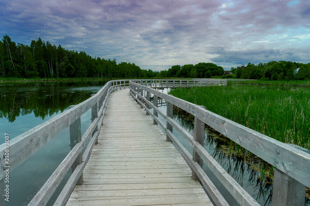 Boardwalk over the lake and marsh at the Sackville Waterfowl Park in Sackville, New Brunswick, Canada.