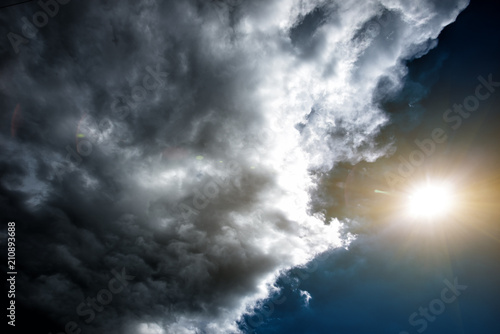 Confrontation of the weather: the sun and the clouds. Concept: the confrontation between people.