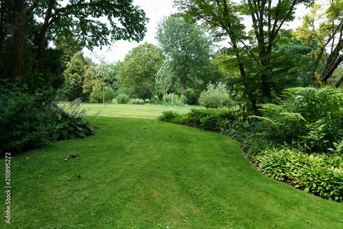 Public well maintained park in Germany in the summer to recover 