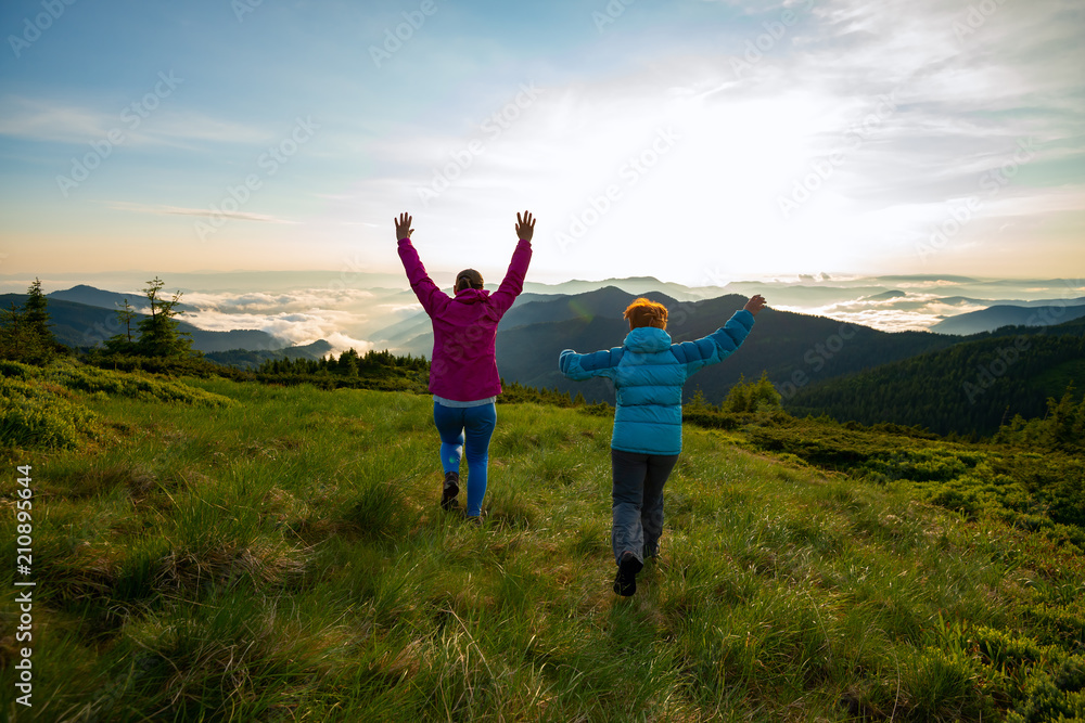 Joyful friends, female are running, jumping and having fun Joyful friends, female are running, jumping and having fun