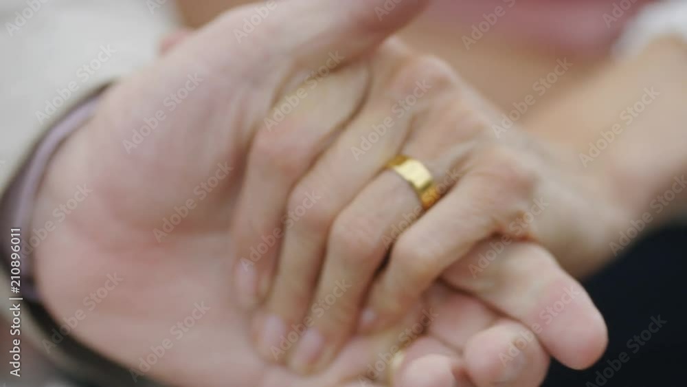 Senior hands of a married couple holding each other Senior hands of a married couple holding each other