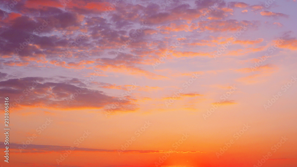bright evening cloudy sky at sunset. bright evening cloudy sky at sunset.