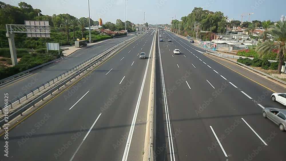 cars are moving along the highway in the city of Netanya Israel. view from above cars are moving along the highway in the city of Netanya Israel. view from above