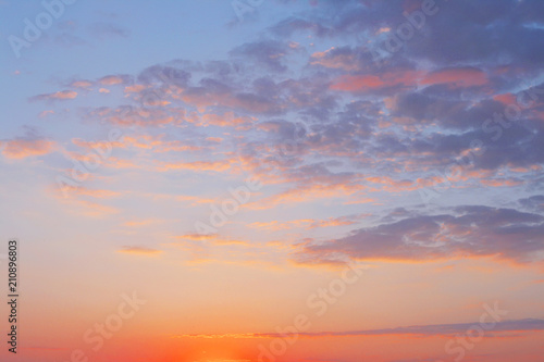 bright evening cloudy sky at sunset.