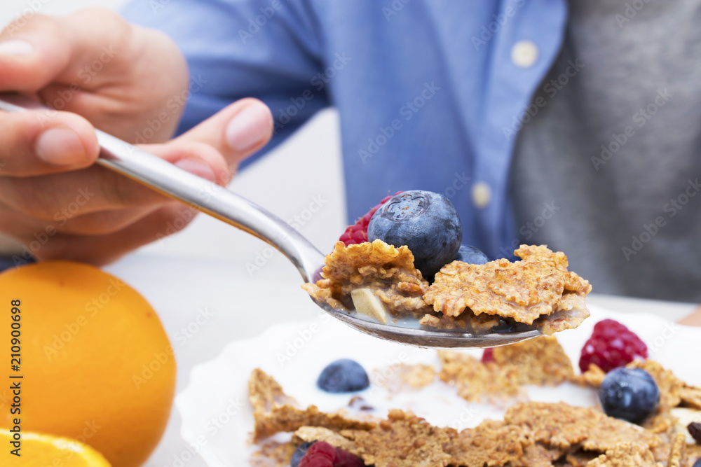 spoon with cereals and fruits, breakfast and healthy snack spoon with cereals and fruits, breakfast and healthy snack
