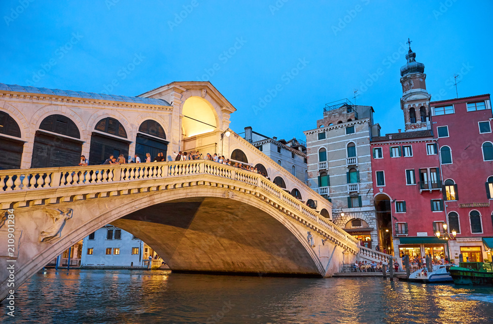 Famous Rialto Bridge in Venice / Illumination at night Famous Rialto Bridge in Venice / Illumination at night