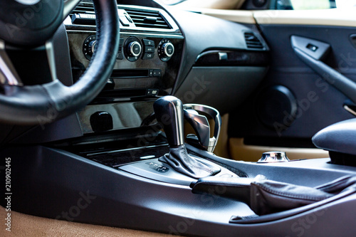 car interior. Modern car speedometer and dashboard. Luxurious car instrument cluster.