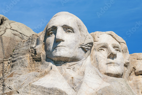 Closeup of George Washington and Thomas Jefferson. Presidential sculpture at Mount Rushmore National Monument, South Dakota, USA.
