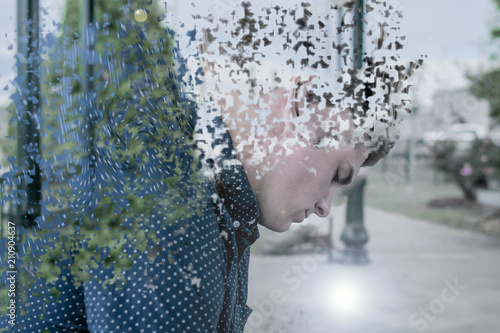 Photography Young man soul leaves him at a train station as his physical body dissolves away into the air of the earth