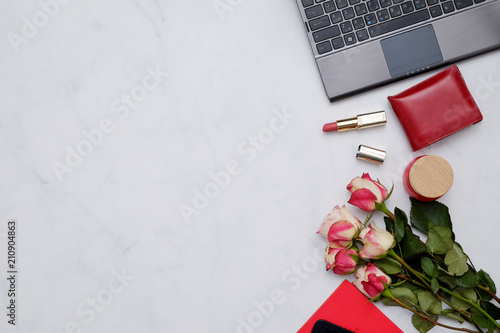 Composition with red items: flowers and cute feminine accessories on the white background. Woman blogger concept. © natus111