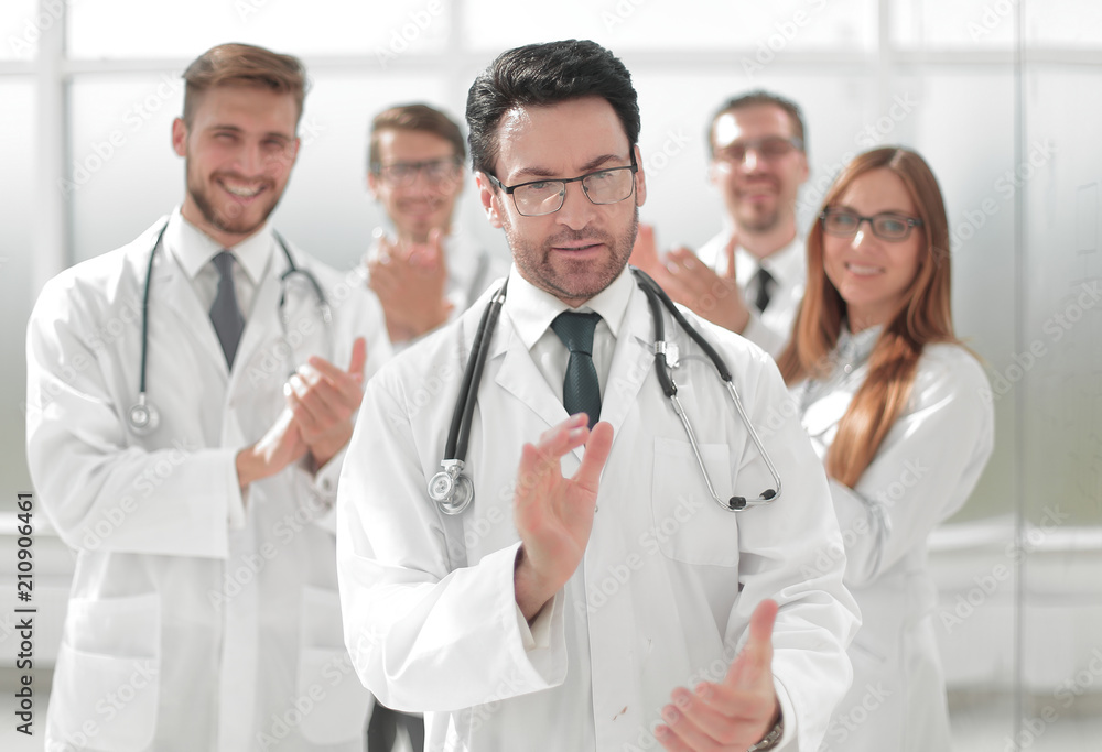 successful doctor, accepting congratulations from colleagues successful doctor, accepting congratulations from colleagues
