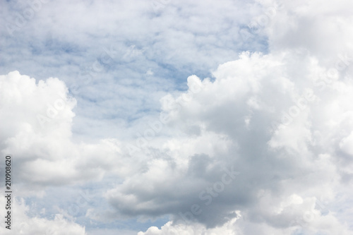 Fototapeta Naklejka Na Ścianę i Meble -  Bright white cumulus and cirrocumulus clouds on blue sky. Summer sunny cloudscape