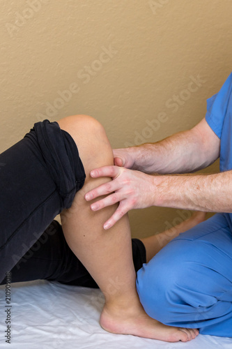 Physical Therapist Works With Patient