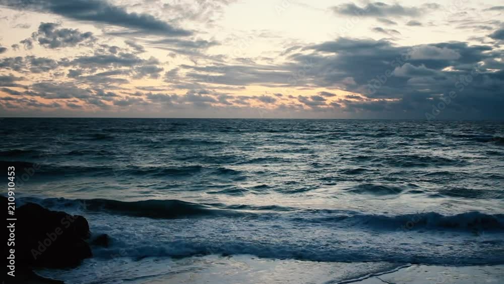 Waves crest along the florida shore during a beautiful morning sunrise Waves crest along the florida shore during a beautiful morning sunrise