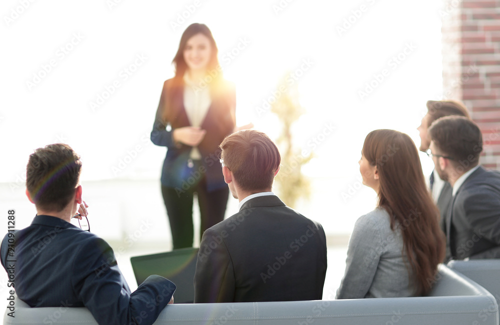 Fototapeta premium Group of happy business people discussing papers at meeting.