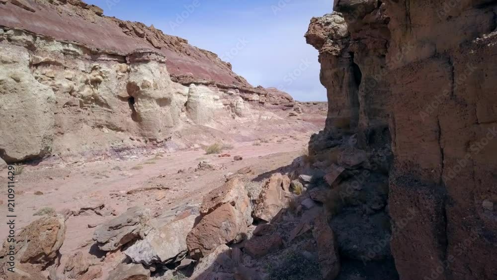 Slowly flying through dry desert was past cliff of sharp rocks in the Utah desert. Slowly flying through dry desert was past cliff of sharp rocks in the Utah desert.