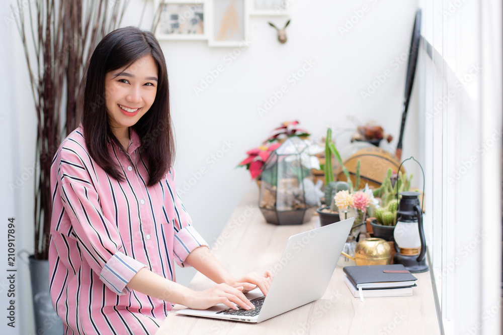 Beautiful of portrait asian young woman working online on laptop sitting at coffee shop, professional female freelancer using notebook computer with connect to internet for distance job. Beautiful of portrait asian young woman working online on laptop sitting at coffee shop, professional female freelancer using notebook computer with connect to internet for distance job.