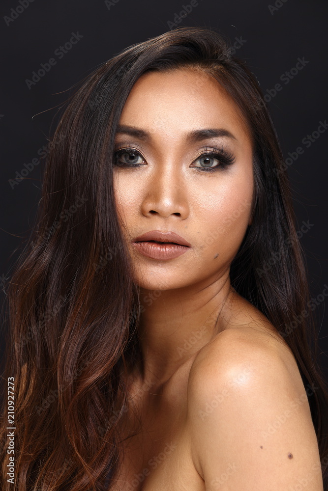 Asian Long straight black hair tan skin woman in Black dress Asian Long straight black hair tan skin woman in Black dress