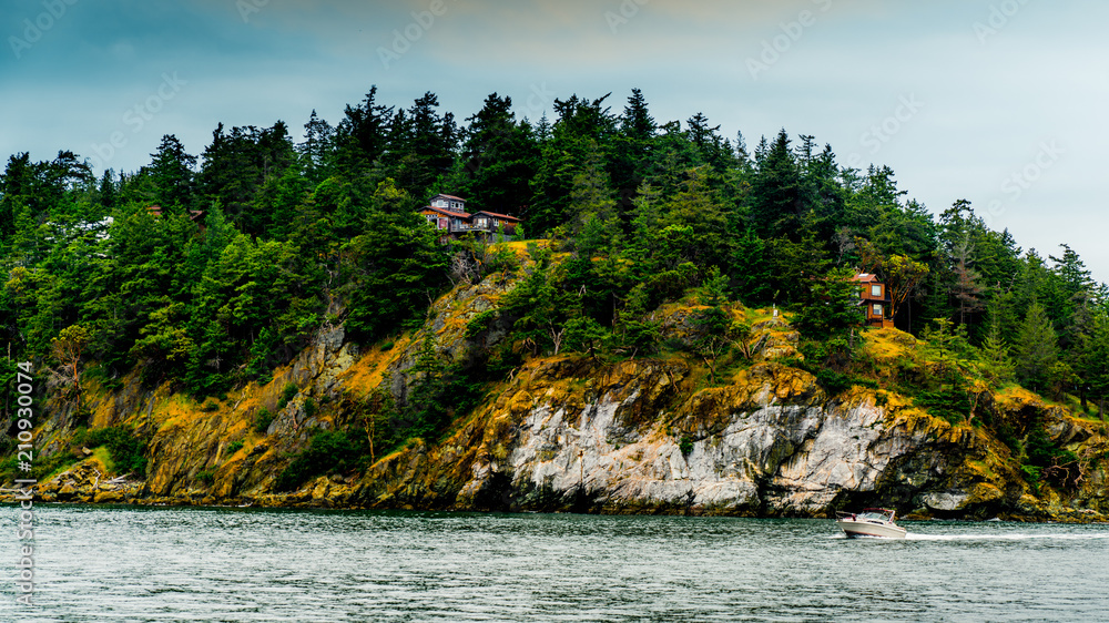 House on top of an island with stair to the ocean. The Evergreen State, Washington, USA.
