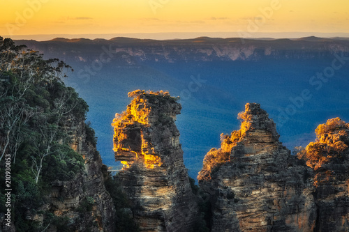 First sunrays in the morning at Three Sisters in Blue Mountains, Katoomba, Australia photo