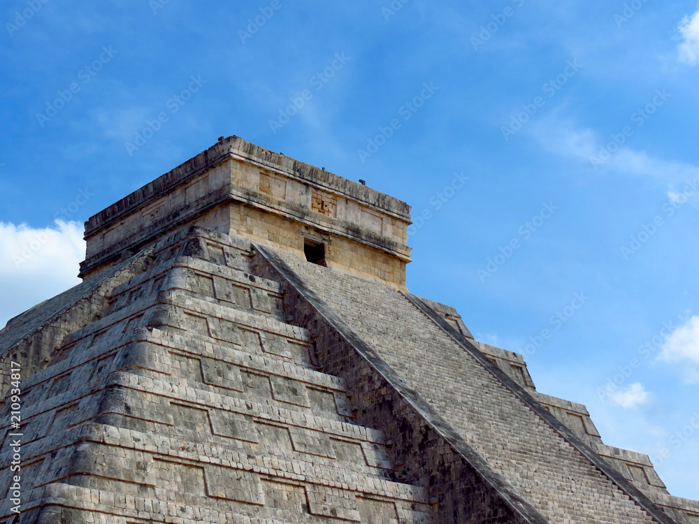 People visiting the ancient buildings of maya culture in chichen itza, quitana roo, mexico, like the pyramid, jaguar temple, planetary, etc.
