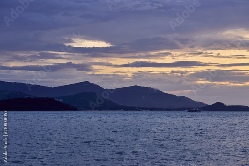 Spectacular sunset over sea lagoon and mountains  