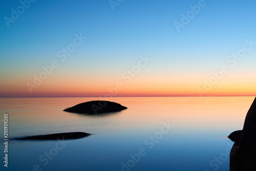 Beautiful sunset over the sea. Tranquil sunset at the sea.