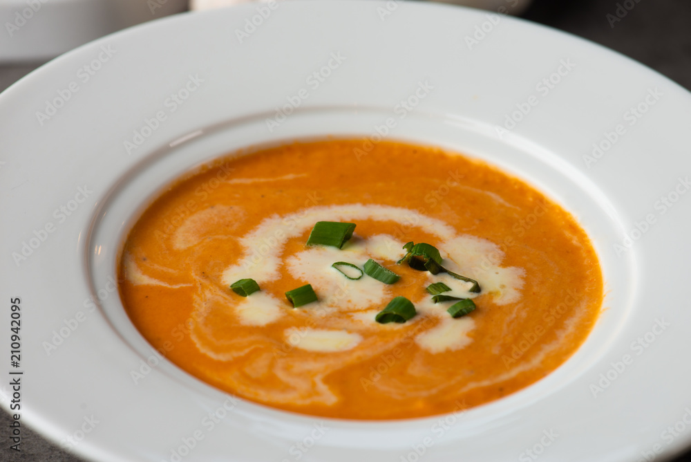 pumpkin soup with spices on table