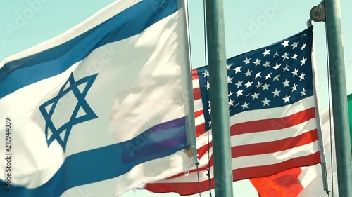 Israeli, American, and Italian Flags fly in a row in Slow Motion