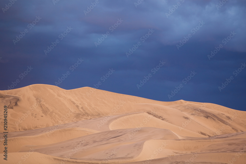 Tall Sand Dunes Under Stormy Skies Tall Sand Dunes Under Stormy Skies