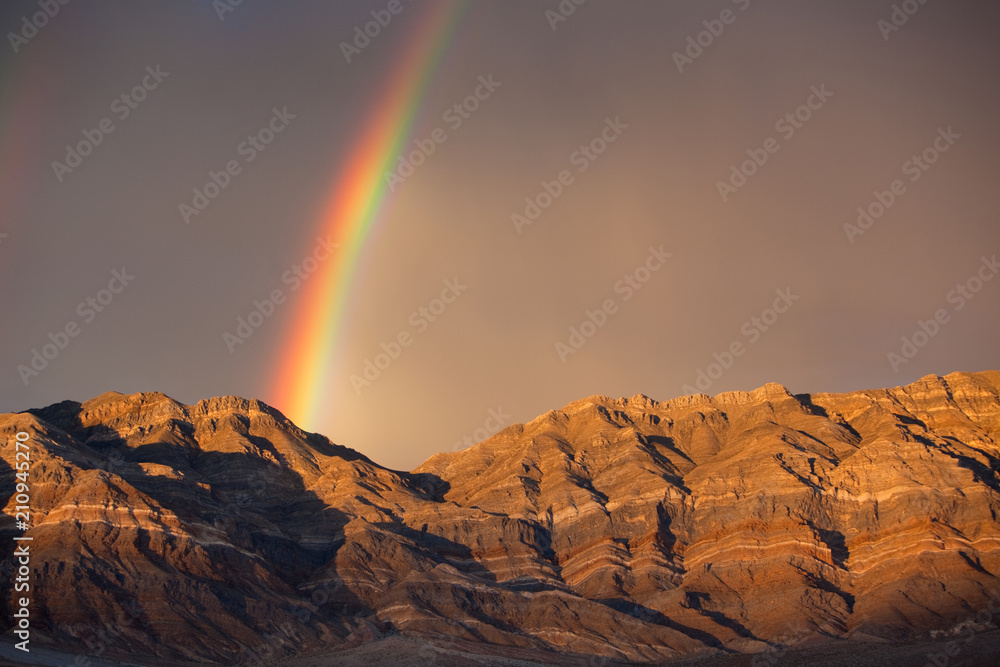 Rainbow Over Banded Mountains