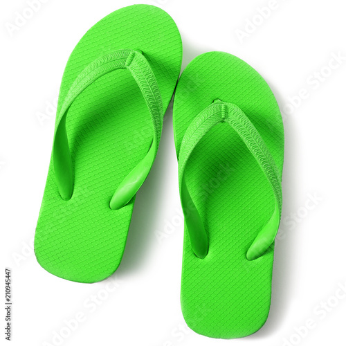Bright green flip flop sandals isolated on white background