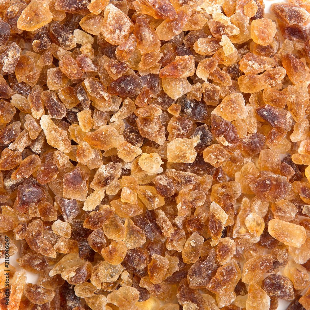 Brown sugar gravel crystals On a white background Brown sugar gravel crystals On a white background