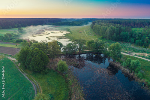 Early morning, wilderness. Aerial view of countryside and river