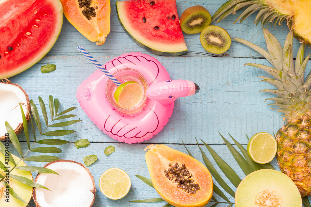 Tropical holiday summer abstract background with palms  fruits drink and flamingo
