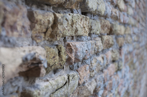 wall texture with an old broken brick