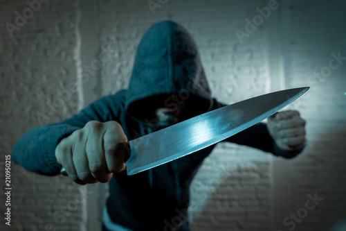 Obraz na plátne close up of man holding knife in knife crime concept photo