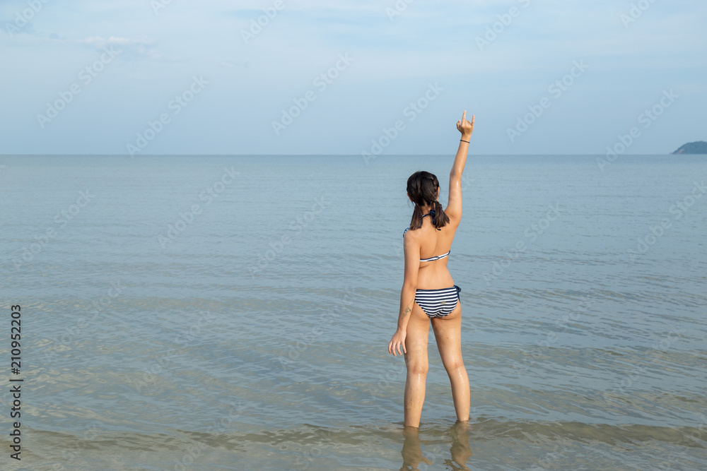 Fototapeta premium Teenage ware bikini at the beach.