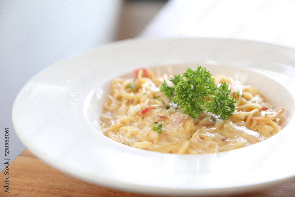 Spaghetti white sauce (Spaghetti Carbonara) with bacon and garlic , on wood table background