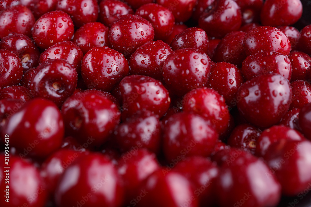 Close up of ripe sweet cherries pile. Large collection of fresh red cherries. Ripe cherries background. Close up of ripe sweet cherries pile. Large collection of fresh red cherries. Ripe cherries background.