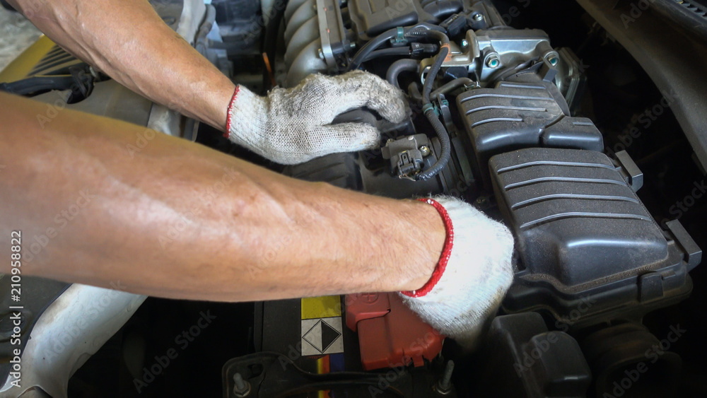 Technician is changing new air filter for car, automotive spare part