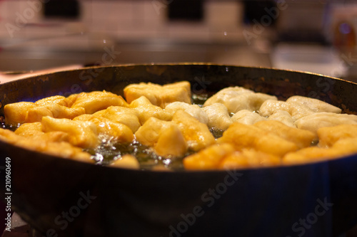 Selective focus deep fried dough stick in big pan,Traditional Thai street food