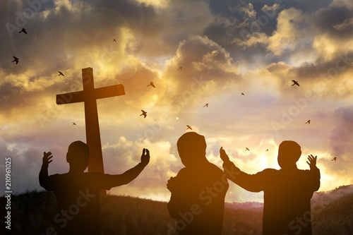 The cross with sunset in the sky background