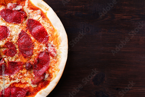 Restaurant, food delivery, pizzeria menu concept. Appetizing pepperoni pizza flat lay with copy space. Delicious classical recipe, traditional Italian snack