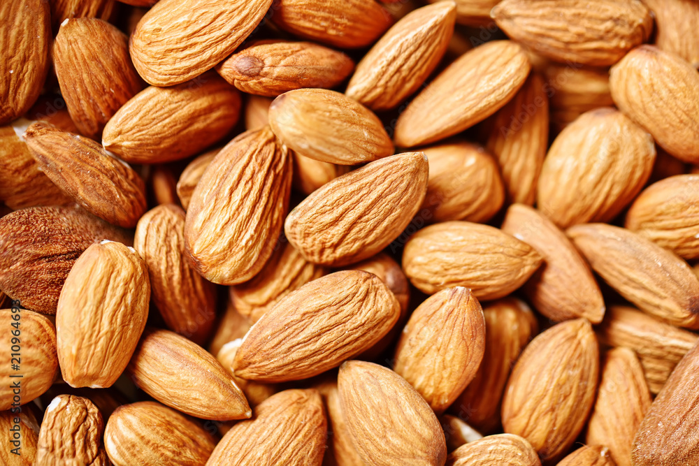 Almond on a wooden table in the summer garden. Useful food. Healthy lifestyle. Almond on a wooden table in the summer garden. Useful food. Healthy lifestyle.